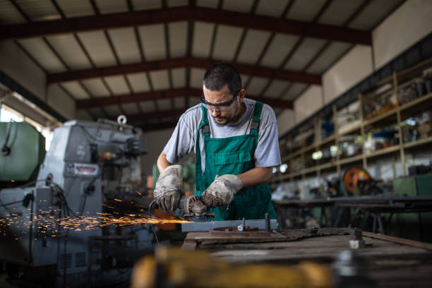 Working with angle grinder in metal industry