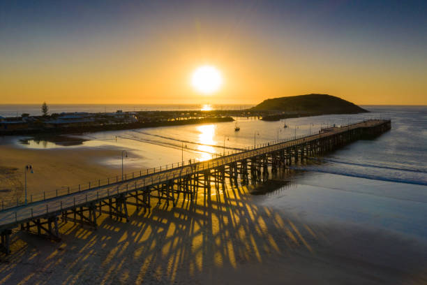 Australia. Coffs Harbour, New South Wales Aerial View of Coffs Harbour Jetty at Sunrise coffs harbour stock pictures, royalty-free photos & images