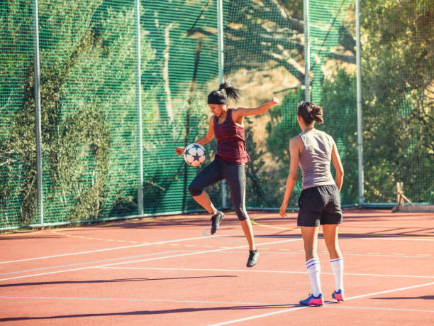 istock Young female athlete training with friend 1177015065