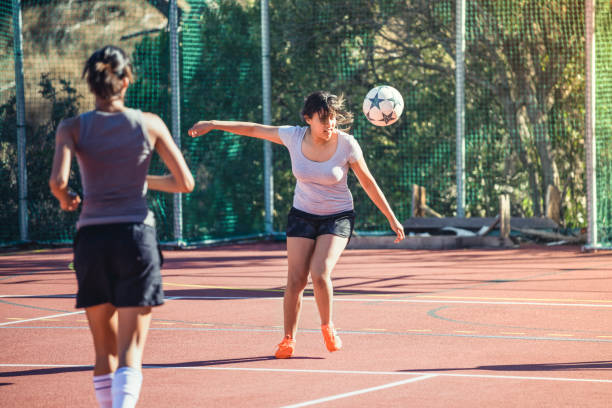 istock Young female athletes playing soccer on sunny day 1177015145