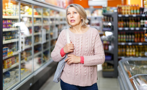 istock Pensive female shopping at store 1177019204