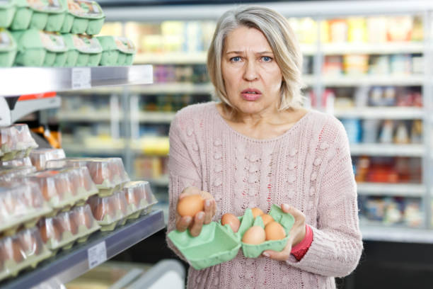 istock Dissatisfied mature woman choosing eggs 1177019296