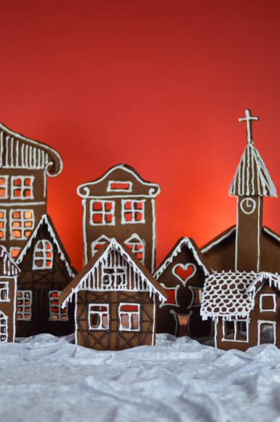 istock home made gingerbread village with red background 1177019380
