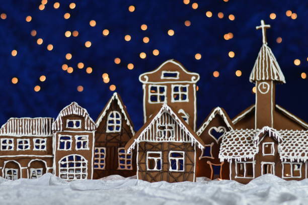 home made gingerbread village with bokeh sky