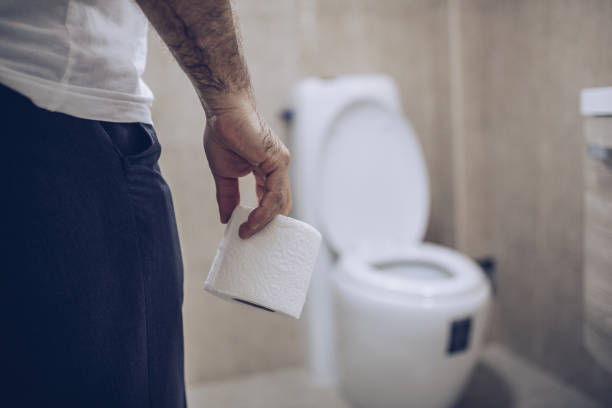 istock Man suffers from diarrhea holds toilet paper roll 1177020102