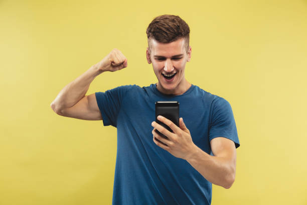 istock Caucasian young man's half-length portrait on yellow background 1177020779