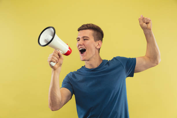 istock Caucasian young man's half-length portrait on yellow background 1177020928