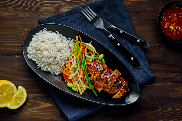 istock Teriyaki chicken with salad and rice 1177021210