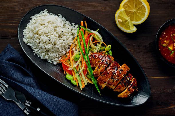 istock Teriyaki chicken with salad and rice 1177022858
