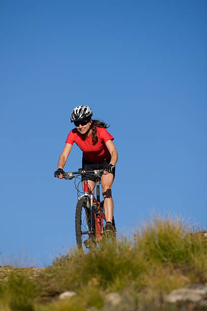 istock Young Woman Mountain Biking 117702288