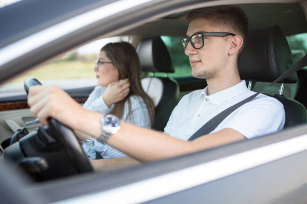 istock Young couple traveling in car 1177024383
