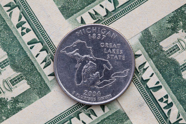 istock A quarter of Michigan on US dollar bills. 1177024501