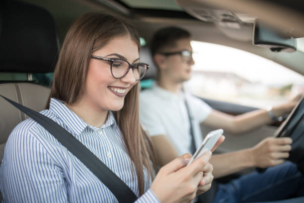 istock Young couple in car enjoying day 1177024954