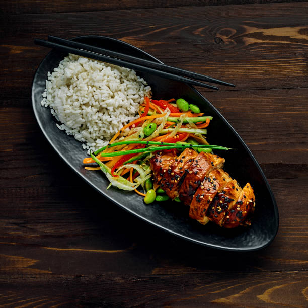 istock Teriyaki chicken with salad and rice 1177024980