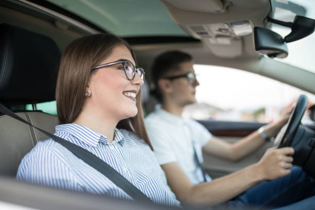 istock Young couple traveling in car 1177025178