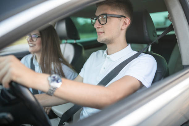 istock Young couple traveling in car 1177025464