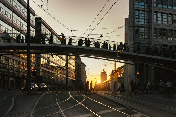 istock people walking over bridge in munich at sunset hour 1177029028