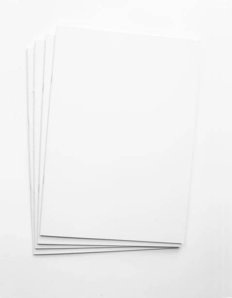 White blank paper brochure publications background Several printed magazines are laying on top of each others as a stack on white background with copy space. The templates can be used for your design ideas stackable stock pictures, royalty-free photos & images