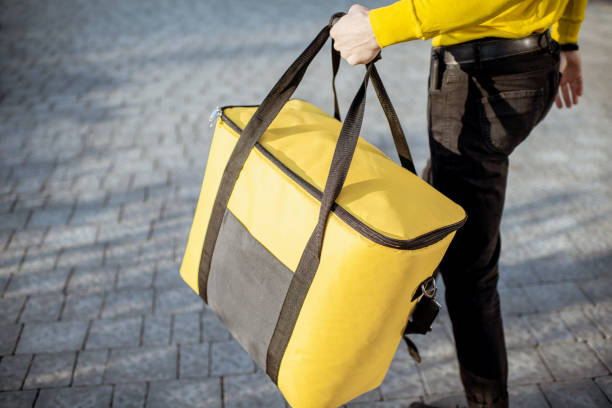 istock Courier carrying thermal bag, delivering food 1177031943