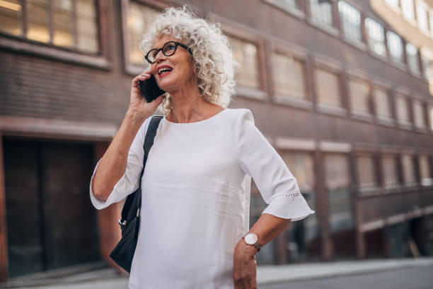 istock Charming woman talking on mobile on the street 1177033559