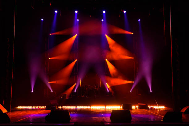 istock Lights beams on stage with musical instruments 1177033611