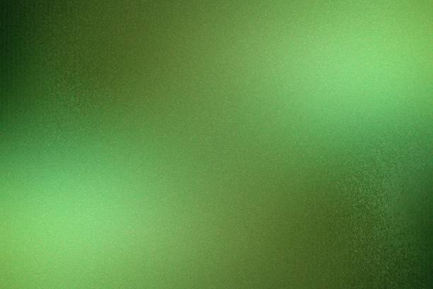 Brushed dark green metallic wall with scratched surface, abstract texture background stock photo