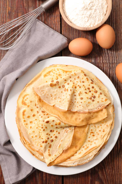 istock crepe with egg and flour, top view 1177035941