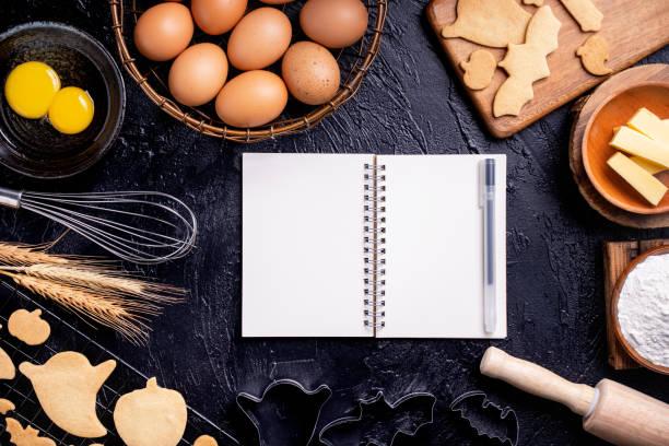 istock Making cookies cookbook recipe design concept, baking ingredients preparation layout with notebook. 1177036710