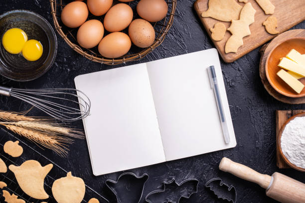 istock Making cookies cookbook recipe design concept, baking ingredients preparation layout with notebook. 1177036947