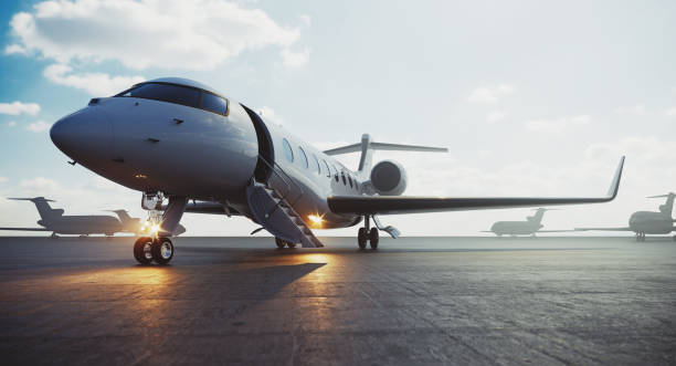 corporate business class jet airplane parked at airfield and waiting vip persons for take off. luxury tourism and business travel transportation concept. 3d rendering. - corporate jet imagens e fotografias de stock