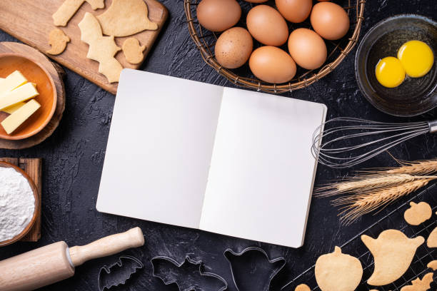 istock Making cookies cookbook recipe design concept, baking ingredients preparation layout with notebook. 1177037140