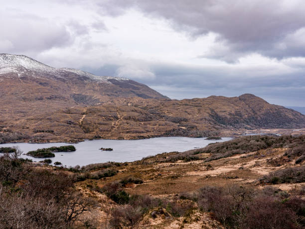 istock Grassy fields in Kerry, Ireland overlooking a lake 1177037298