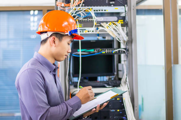 istock A young software engineer who is checking the condition of the hardware hardware in the organization's server room. 1177037400