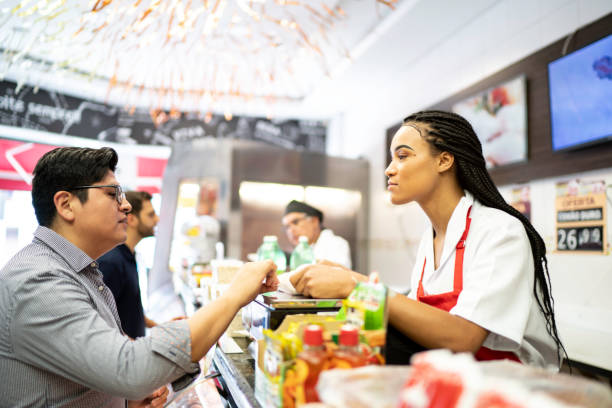 istock Butcher selling products to a customer 1177038006