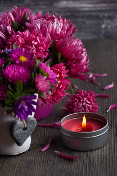 istock Red chrysanthemum and lit candles 1177038135