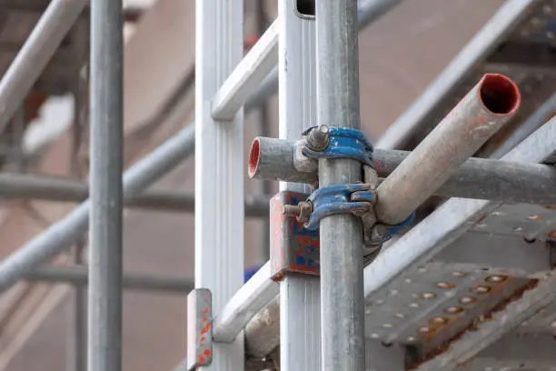 Photo of Construction scaffolding as temporary structure for support safety in construction site for new build building and platform for workers to work.