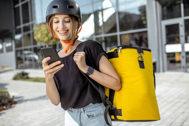 istock Female courier delivering fresh products with backpack 1177039317