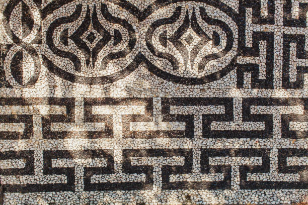 istock An decorated with black and white stones wall 1177043228