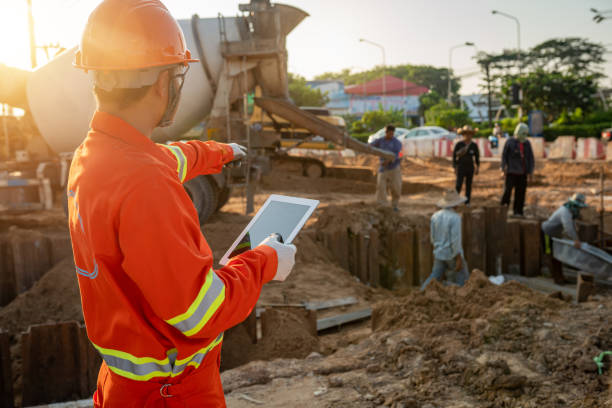 istock Engineers on the outdoor construction site and team 1177043730