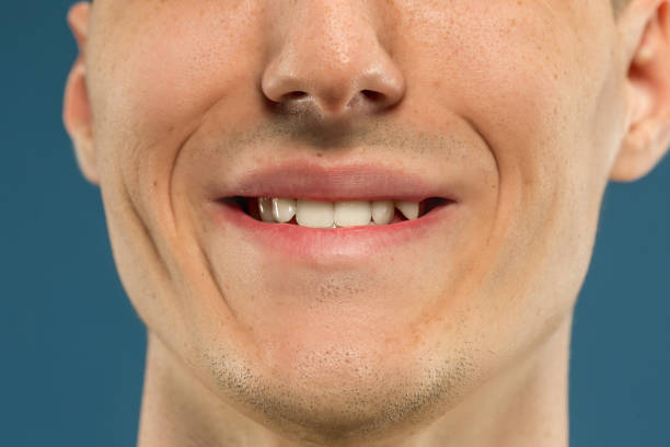 istock Caucasian young man's close up shot on blue background 1177045448