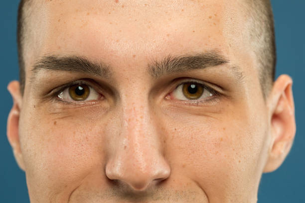 istock Caucasian young man's close up shot on blue background 1177045458