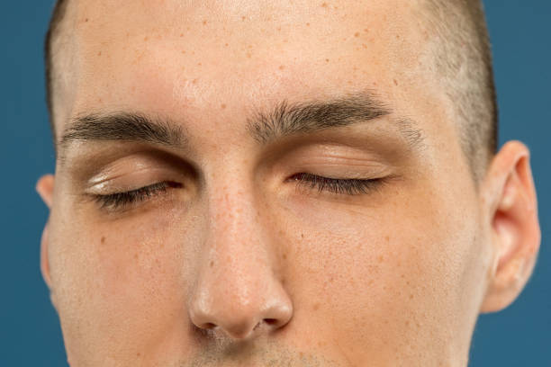 istock Caucasian young man's close up shot on blue background 1177045466