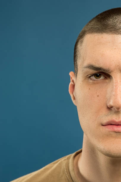 istock Caucasian young man's close up shot on blue background 1177045998