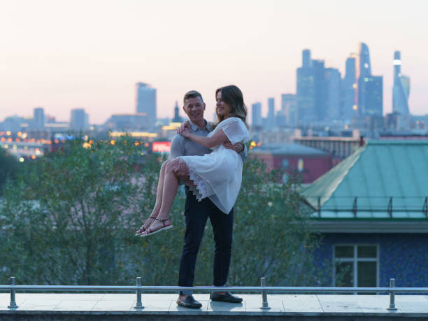 istock Man carrying woman 1177046848