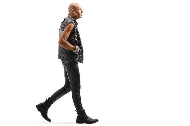 istock Bald punk in leather clothes walking 1177047689