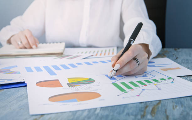 istock business lady working with charts in office 1177049827