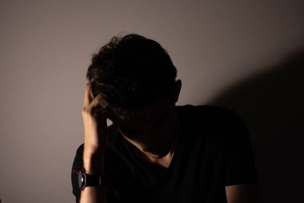 istock Man black shadows silhouette portrait 1177050545