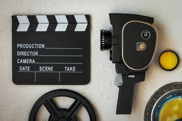 istock A movie camera, a clapperboard, a film box and a yellow filter 1177051457