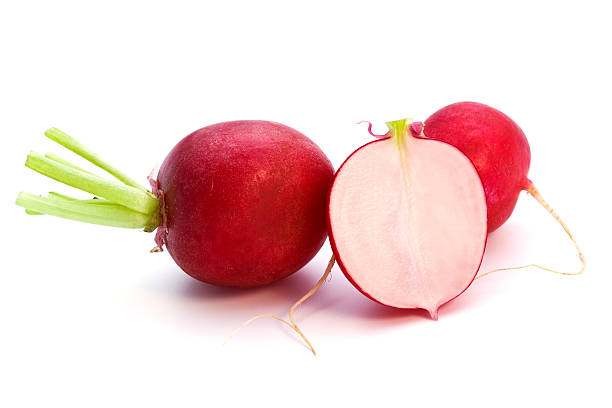 istock A few radishes on a white background, one cut in half 117706030