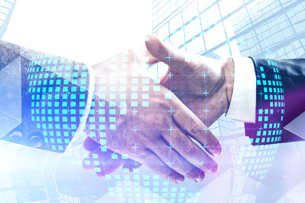 istock Handshake in city, planet hologram 1177061424
